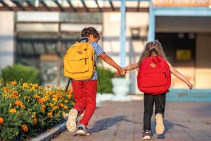 Two young children run down a sidewalk on school grounds on a sunny day. Learn how child counseling in Branchburg, NJ can help your child overcome school anxiety in the new year. Learn more about child counseling in Branchburg, NJ and other services today.