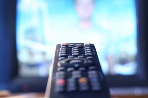 A close up of a TV remote pointing toward a TV. This could represent the exposure teens from outside influences. Learn more about how Scotch Plains therapy and the support that therapy for teens in Branchburg, NJ can offer. Search for adolescent therapy NJ to learn more. 