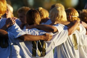 A team of teen athletes huddles to talk about a play. Learn how therapy for teens in Branchburg, NJ can offer support with addressing mistakes in teen athletes. Search for counseling for teens in Scotch Plains, NJ to get in contact with a teen counselor in Branchburg, NJ today. 