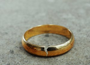 A close up of a cracked ring on a table. This could represent the effects of an affair on a relationship. Learn mow an infidelity counselor in Branchburg, NJ can assist couples by searching for "couples therapy branchburg, nj" today. They can offer relationship support along with other forms of counseling in Branchburg, NJ 