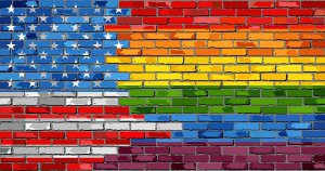 A graphic of brick wall with the American flag mixed with a rainbow pride flag. This could represent having LGBTQ affirming rights in America. Contact an LGBTQIA+ therapist in Branchburg, NJ to learn more about how LGBTQ therapy in Scotch Plains, NJ can help address concerns in the LGBTQ community. Search for LGBTQIA therapy in Branchburg, NJ today.