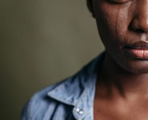 A close-up of a person's face with a single tear running down their cheek. The person appears to be experiencing deep sadness. Learn how support for loss and grief in Scotch Plains, NJ can offer support for addressing grief. Search for grief counseling in Westfield, NJ to learn more about Scotch Plains therapy. 